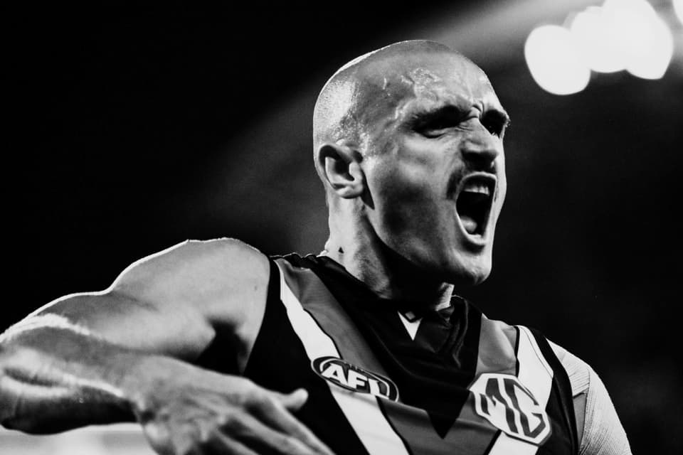 Sam Powell-Pepper mid-celebration, photographed in black and white.